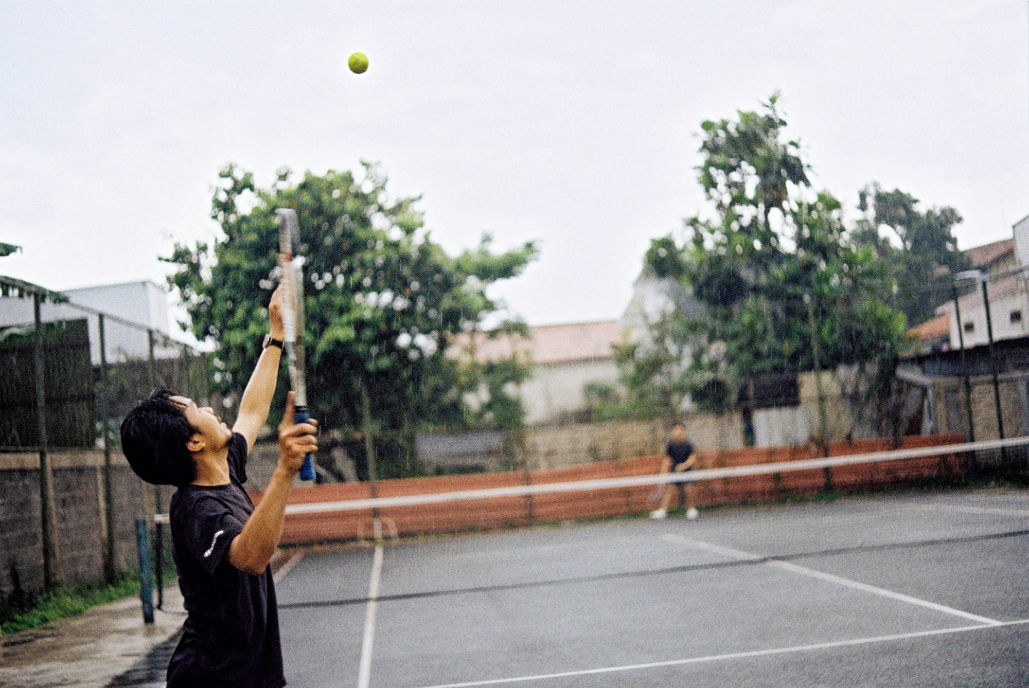 Serving on a tennis court