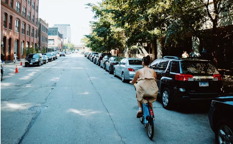 Cycling down a tree-lined street